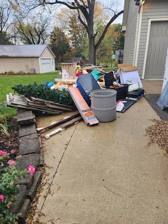 Dumpster being loaded with debris for 3 Yard Dumpster Rental in Fort Collins